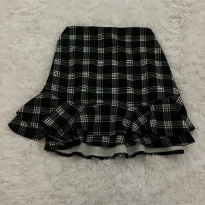 Black and white ruffled mini skirt